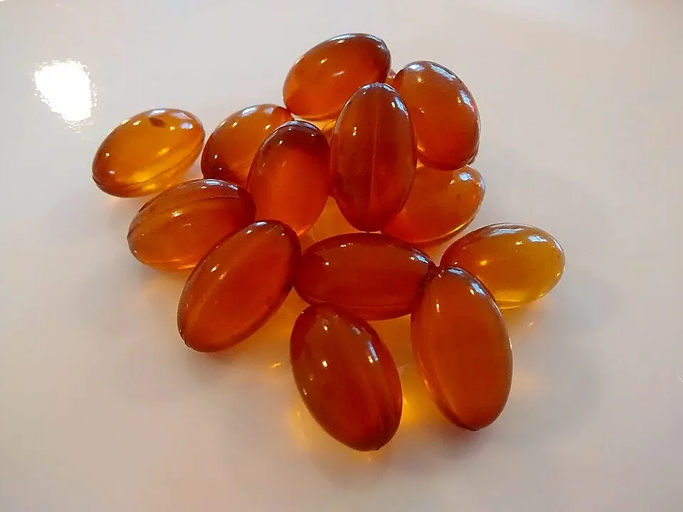 Amber softgel supplement capsules